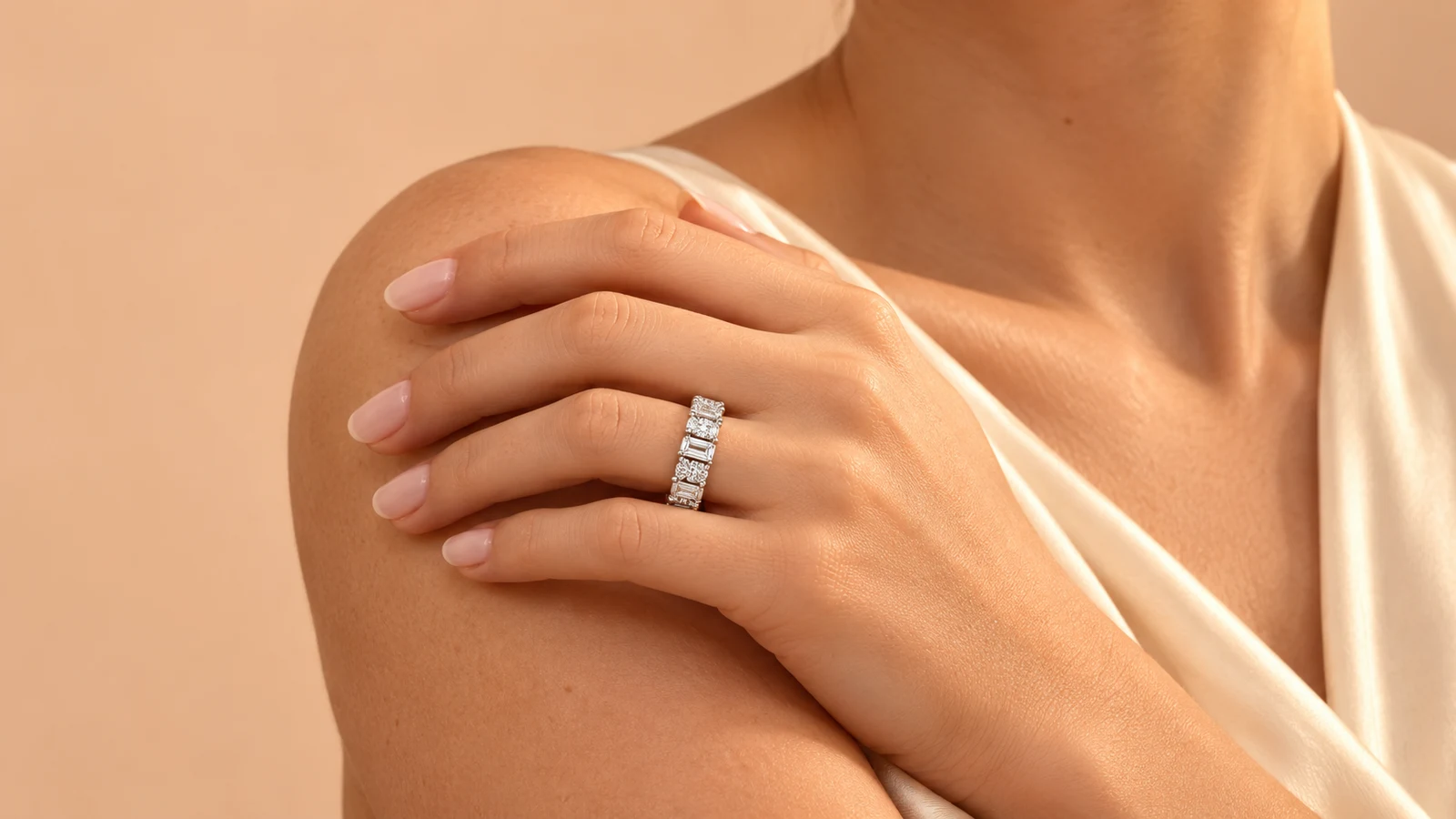 The Éclat ring worn with cream silk